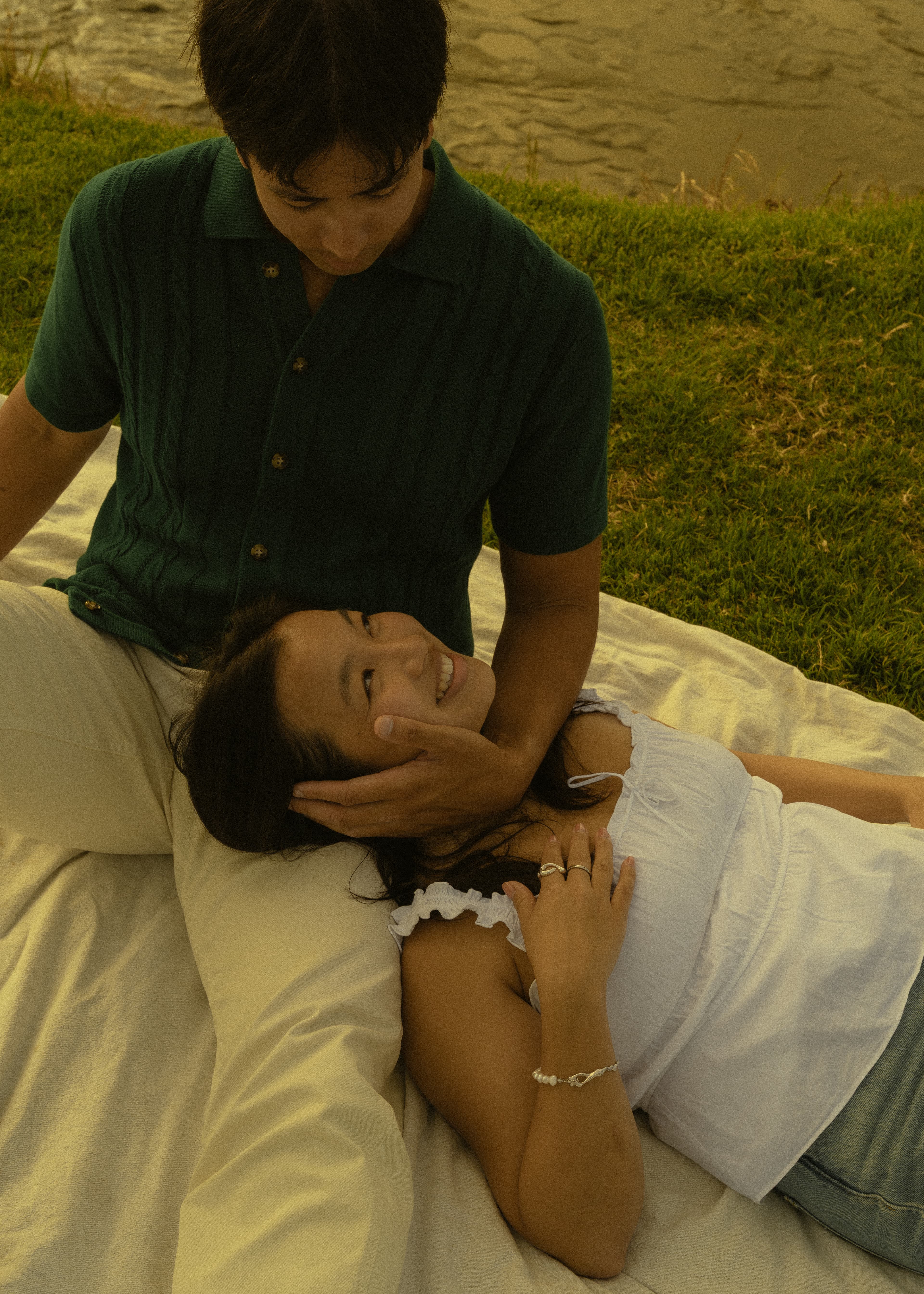 Ruth smiling beside DT on a picnic blanket